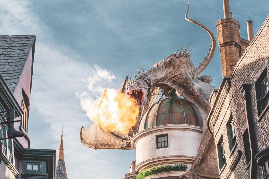 Dragon breathing fire over fantasy castle dome – fantasy audiobook theme
